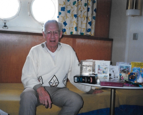 John Tonks. At sea, In the cabin with birthday cards & presents